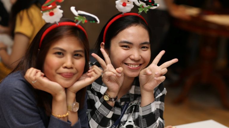 Two Finexus employees celebrating Christmas